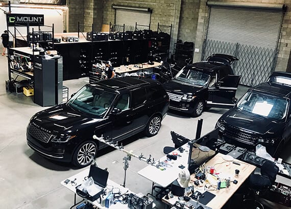 Garage of Range Rovers getting prepped for production installations.